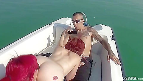 A group of men fucks a mature redhead with a tattoo